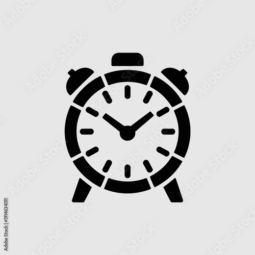 Black and white of an analog alarm clock with two bells on analog clock time