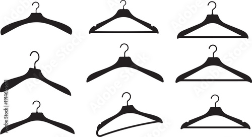 Collection of black clothes hangers on white background