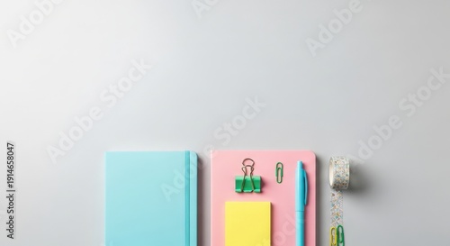 Wallpaper Mural Assortment of Pastel Stationery and Office Supplies Arranged on a Light Gray Surface Torontodigital.ca