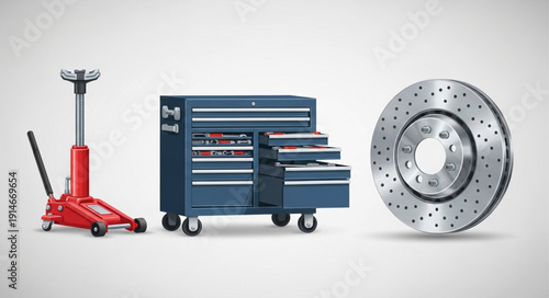 Automotive repair tools including a floor jack toolbox and brake rotor.
