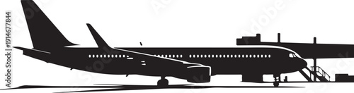 Black and white airplane at airport gate with jet bridge attached