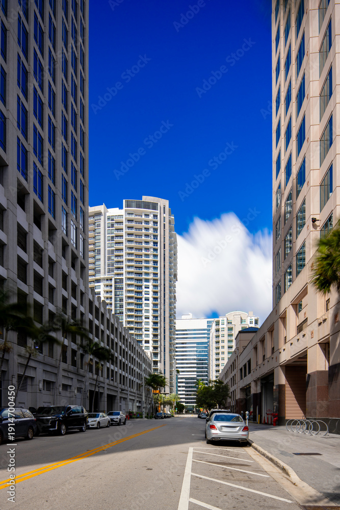 Fototapeta premium Fort Lauderdale Florida view down street between highrise towers 2026