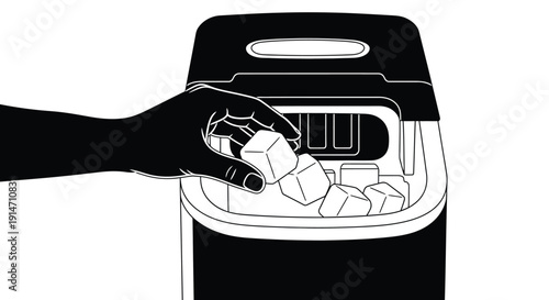 Hand placing ice cubes into a black and white ice maker appliance