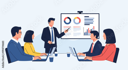 Professional business meeting where a male presenter is showing data charts on a screen to seated colleagues with laptops.