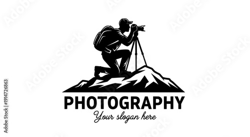 Photographer silhouette logo on a mountain peak with camera