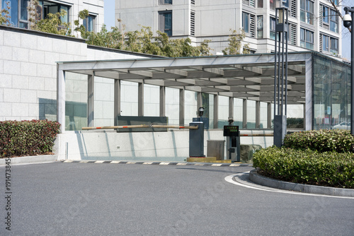 Εκτύπωση καμβά Modern building entrance with glass canopy, barrier gate, and security facilitie