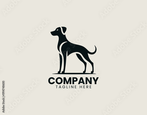 Black vector logo dog standing in alert pose with large floppy ears and slim body proportions