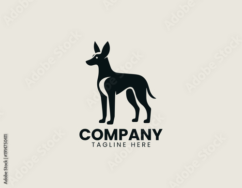 Black vector logo dog standing in alert pose with large floppy ears and slim body proportions