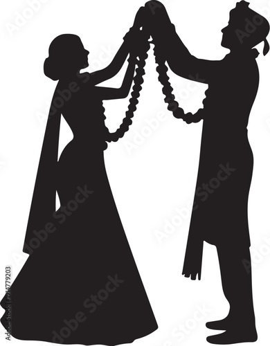 Silhouette of bride and groom exchanging garlands wedding
