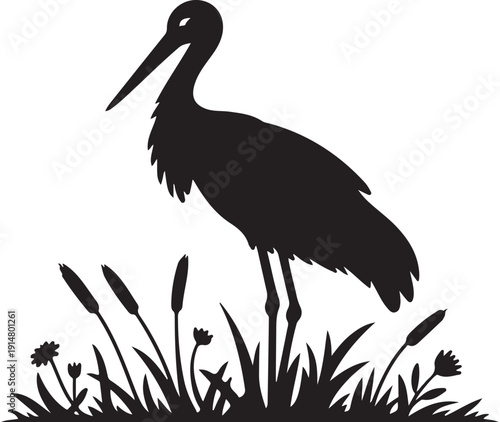 Black silhouette of a bird standing in grass with flowers