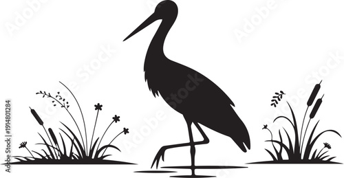 Black silhouette of a bird standing in a marsh with plants