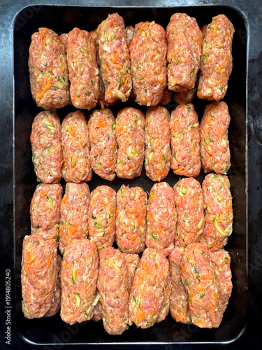 preparing food, skinless minced meat sausages ready for cooking