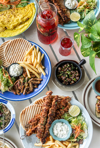 Wallpaper Mural many different mediterranean food dishes on restaurant table in greece Torontodigital.ca