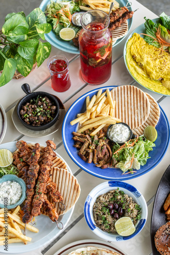 Wallpaper Mural many different mediterranean food dishes on restaurant table in greece Torontodigital.ca