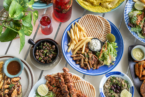 Wallpaper Mural many different mediterranean food dishes on restaurant table in greece Torontodigital.ca