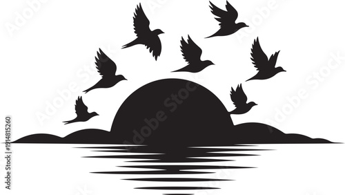 Silhouette of birds flying over a sunrise above water