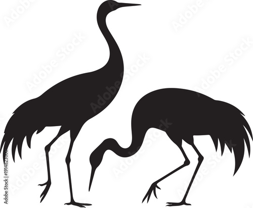 Two black silhouettes of birds with long necks and legs