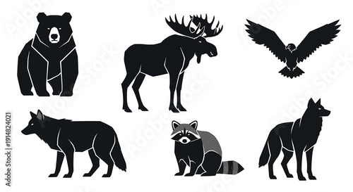 A collection of silhouetted forest animals including a bear, moose, wolf, raccoon, and eagle displayed together