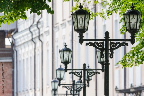 Vintage street lamps in historic city alley