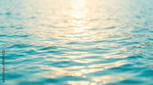 The water is calm and blue, with a sun shining on the surface