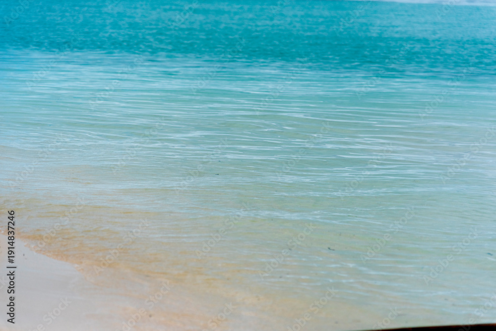 Obraz premium Blue sea white beach turquoise ocean wave coastal in tropical paradise landscape. Beautiful scene seascape marine coastline destinations. Tropical beautiful blue ocean lagoon lake travel summer time.