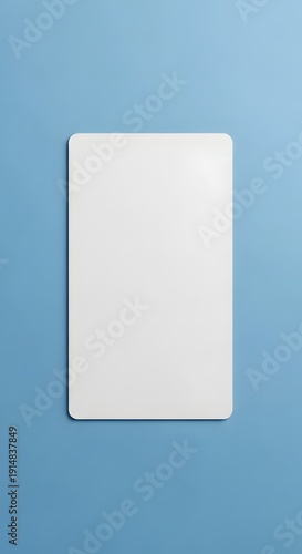 Blank white rectangular card with rounded corners on a solid blue background, top view.