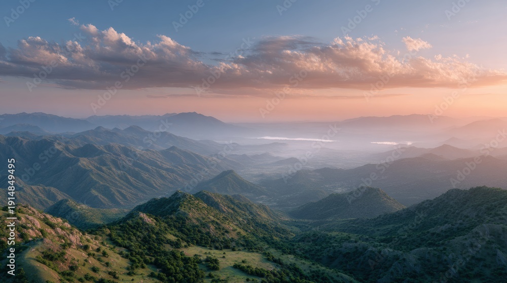 Fototapeta premium Golden Sunset Over Tranquil Mountainous Landscape.