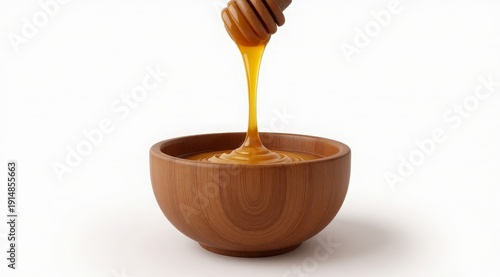 Golden honey drips into a wooden bowl against a soft bokeh background. Stylish food photography for packaging, recipes, or organic product advertisements