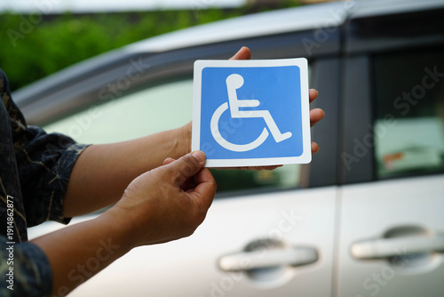 Wheelchair sticker sign on car for safety travel.