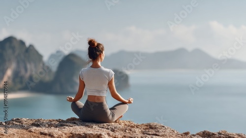 Back view of female meditating in scenic location