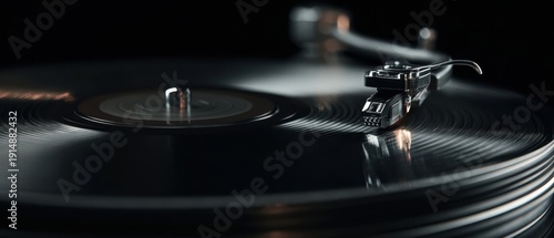 The vinyl record on a vintage turntable with stylus close-up