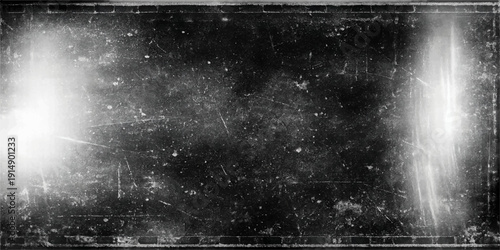 A dark vintage night scene features a fountain in the rain with a water splash on a black background and a textured grunge metal surface