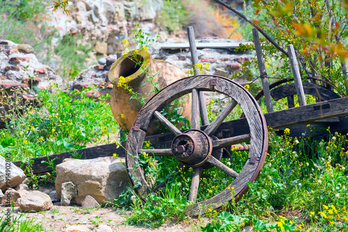 old traditional georgian wine region symbol background with wheel and qvevri jug