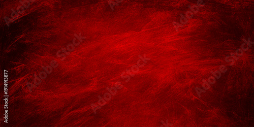 A dark red grunge background featuring a textured abstract paint design with a dirty old wall pattern for a festive Christmas wallpaper backdrop or artistic surface decoration
