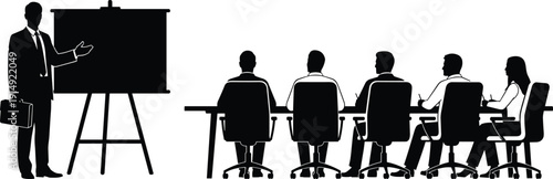 Professional businessman silhouette giving corporate presentation with flipchart to diverse business team sitting at conference table in office meeting room for seminar and workshop