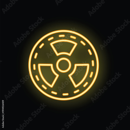 Yellow neon sign is glowing on black background showing radioactive hazard symbol