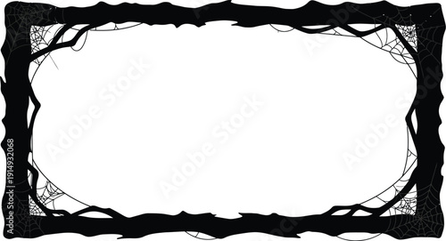 Dark branches and spiderwebs create a spooky framed border silhouette