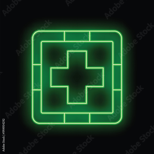 Green neon sign first aid kit icon glowing on black background