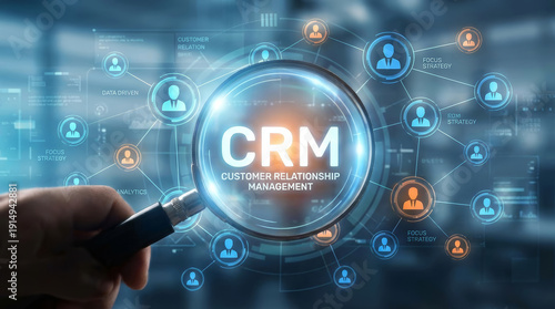 Magnifying glass focus on CRM customer relationship management text with people network connection showing professional digital business success concept