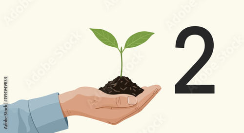 Hand nurturing young plant with soil and green leaves