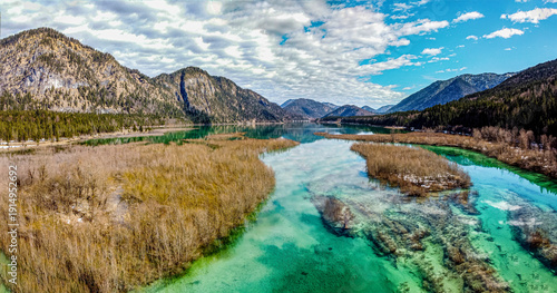 Turquoise alpine lakes surrounded by forests and mountain peaks in the Bavarian Alps Walchensee and Isar river