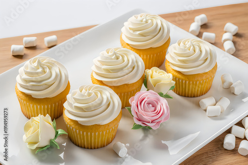 Delicious cupcakes with white frosting
