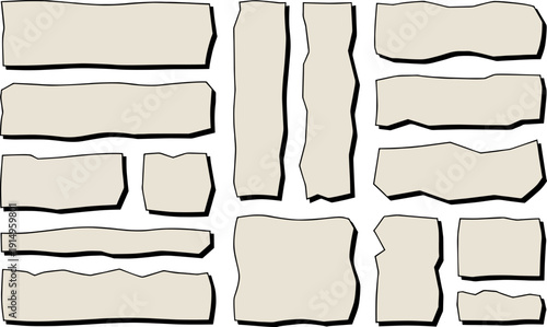 A collection of variously shaped and sized blank paper scraps in a neutral beige color.