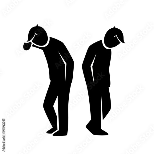 Two men standing with their heads bowed down in sorrow or disappointment.