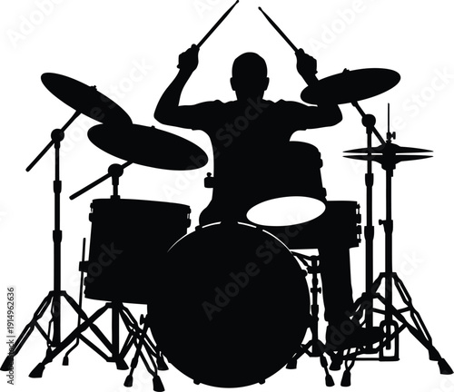 Drummer silhouette playing a complex full drum set with raised sticks.