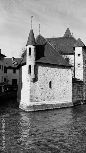 Monochrome Photography Of Ancient Palais De L'Isle Building On Annecy Canal