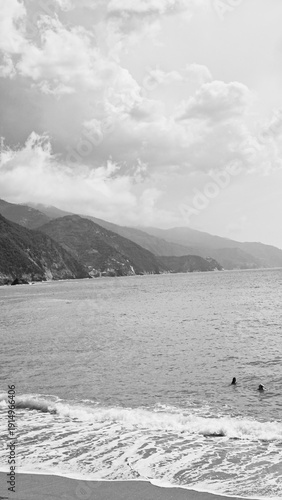 Monochrome Panoramic View Of Rugged Mountains And Coastal Cliffs In Italy