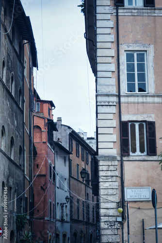 Dramatic Monochrome View Of A Narrow Roman Alley With Deep Shadows