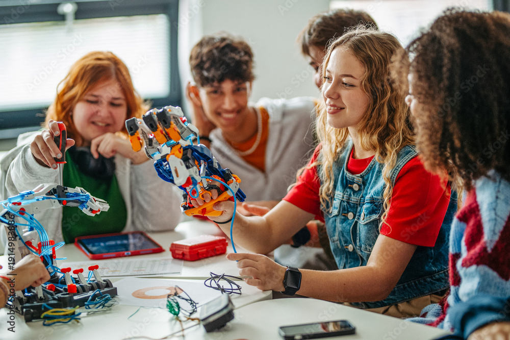 Fototapeta premium Diverse group of students working on engineering school project.