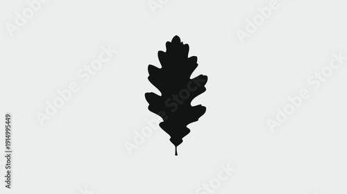 A grayscale image features a silhouette of a leaf with defined edges set on a neutral background
